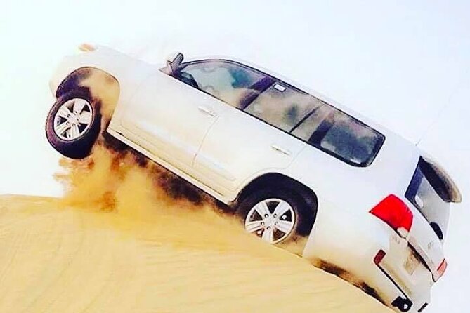 Abu Dhabi: 7-Hours Desert Safari with BBQ, Camel Ride & Sandboarding - Bedouin camp in Abu Dhabi: henna, local dress, falcons, and dinner pacing