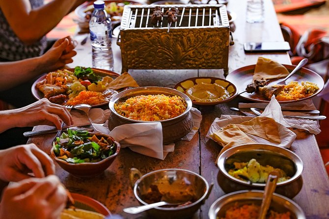 Abu Dhabi: Desert Safari with BBQ, Camel Ride & Sandboarding - Pickup, duration, and the small-group advantage in Abu Dhabi