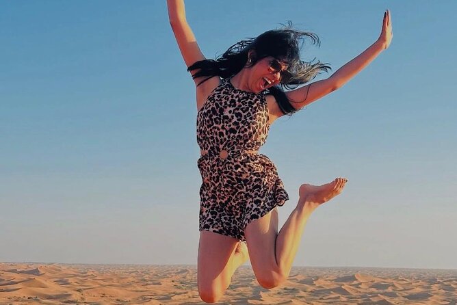 Abu Dhabi Desert Safari with Live Entertainment and Live BBQ - Camp time: camel rides and sandboarding before the night shows