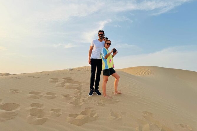 Abu Dhabi Desert Safari With Live Shows And BBQ Buffet Dinner - 4x4 Dune Bashing, Camel Ride, and Sandboarding