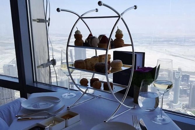 Atmosphere Burj Khalifa High Tea Experience with Private Transfer - Getting there: private car pickup, Armani entrance access, and timing