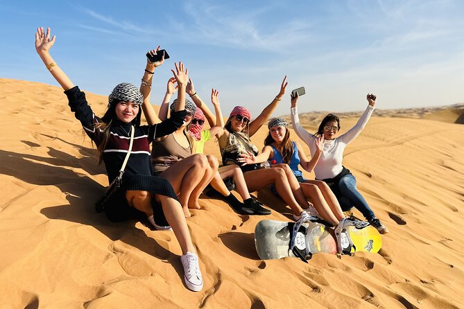 Best Dubai Desert Safari with Buffet Dinner,Sand Boarding & Shows - The Desert Camp Experience: Camel Ride, Henna, and Shisha