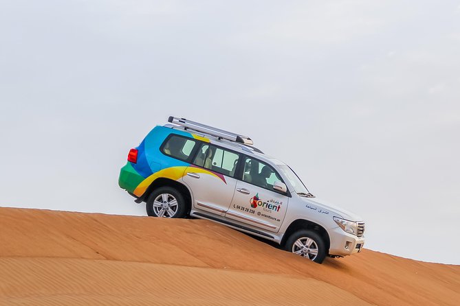 Classic Dubai Desert Safari with BBQ Dinner and Camp activities - Dune bashing in the desert: the part most people remember