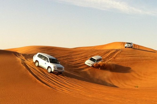 Combo Tour - Dubai Desert Safari and Dhow Cruise Dinner - Day 1 in the desert at 2:00 pm: dune bashing plus Bedouin camp dinner