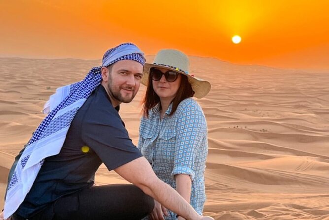 Desert Safari BBQ dinner, Camel ride & sandboarding from Dubai - Tanoura and fire shows: the evening energy shift