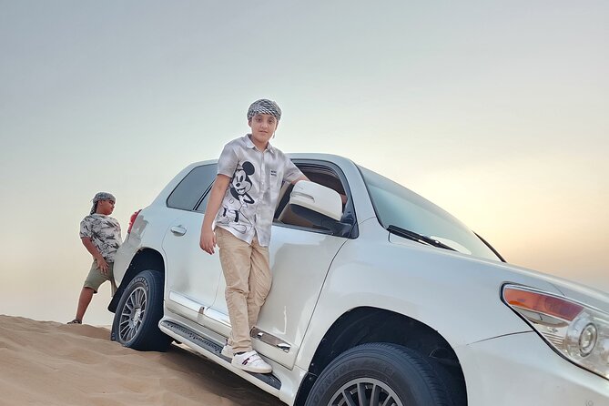 Desert Safari BBQ Dinner, Live Shows, ATV Bikes, Sandboarding - Sunset photography stop and camel ride, the softer side of the dunes