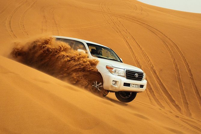 Desert Safari Dubai at Evening with BBQ Dinner - Desert Camp welcome: gahwa, Legemat, camel ride, and henna