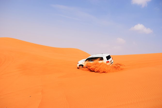 Desert Safari Dubai with BBQ Dinner and Belly Dance - Pickup, group size, and how the day flows