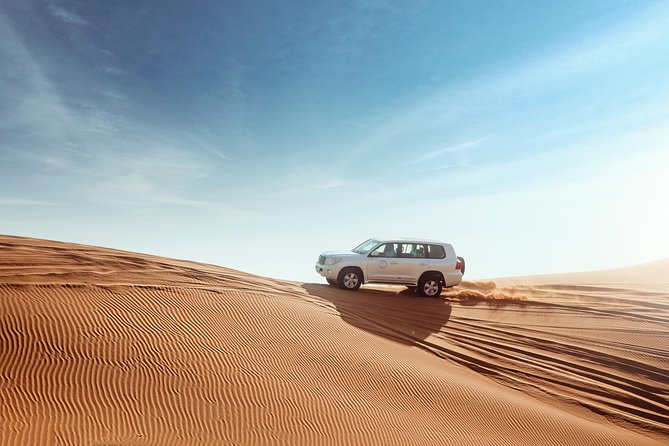 Desert Safari Dubai with Dune Bashing, Sandboarding, Camel Ride, 5 Shows, Dinner - Dune Bashing in 4x4 Cars: Hold On, Then Look at the Stars