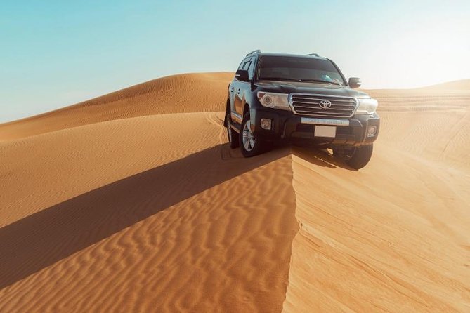 Desert Safari Dubai with Dune Bashing, Sandboarding, Camel Ride, 5 Shows, Dinner - Sandboarding: The Fun After the Adrenaline