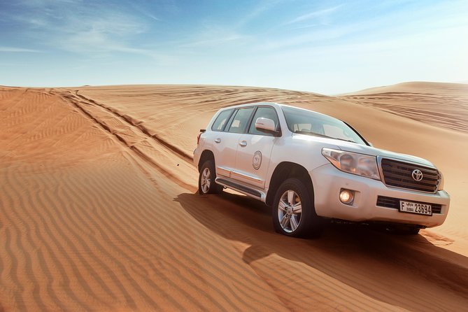 Desert Safari Dubai with Dune Bashing, Sandboarding, Camel Ride, 5 Shows, Dinner - BBQ Dinner and Live Shows: More Than a Meal
