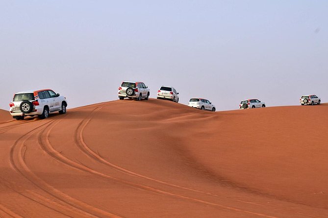 Desert Safari in 4X4 through Lahbab Desert with BBQ Dinner - Bedouin camp: camels, henna, shisha, and the entertainment rhythm