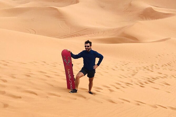 Desert Safari Tour with Camel Ride and BBQ Dinner in VIP Camp - Lahbab dunes: dune bashing, sandboarding, and photo time