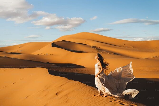 Desert Safari with BBQ Dinner, Camel Ride, Sand Board & Live Show - Desert Camp Time: Camel Ride, Sand Boarding, and Photo Stops
