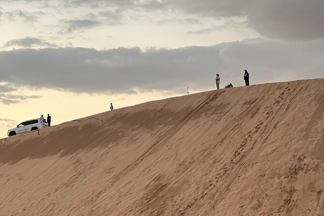 Desert Safari with Dune Bashing and Camel Ride plus Sand Boarding - Stop at Al Khatim: camel farm, then dune bashing