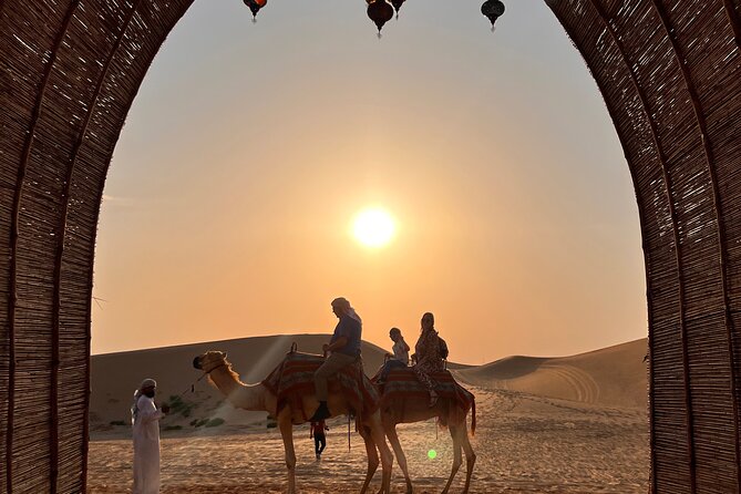 Desert Safari with Dune Bashing and Camel Ride plus Sand Boarding - Bedouin camp welcome: Arabic coffee, dates, and real atmosphere