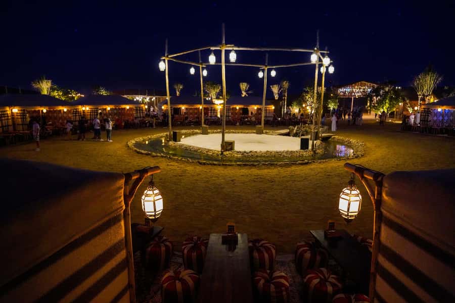 Dubai: Al Khayma Camp Experience with BBQ Dinner - Camel feeding, henna, and the falcon moment you will remember