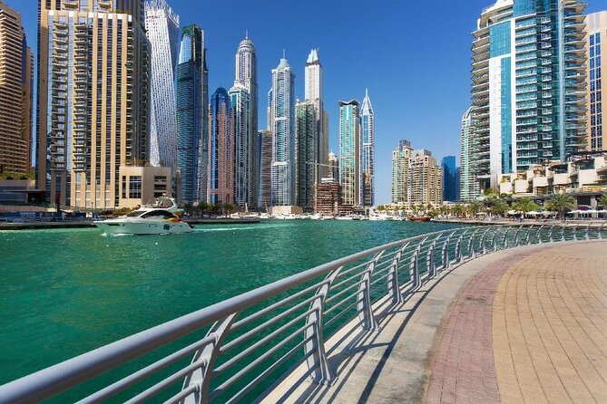Dubai City Tour - The History from Riding Camel to Riding Ferrari - Jumeirah Mosque and Jumeirah Beach: Culture and Coast Views