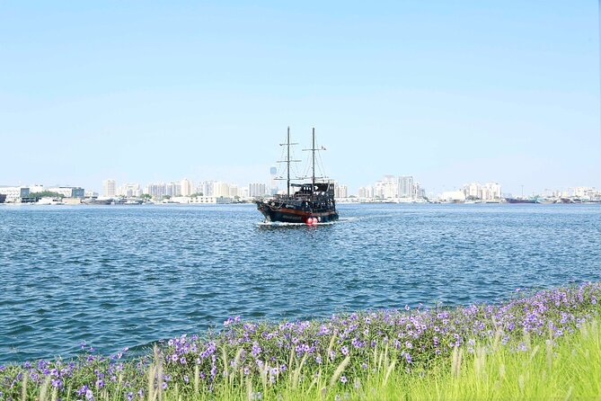 Dubai Creek Harbour Pirate Ship Sightseeing Dhow Cruise - On-Board Atmosphere, Pizza Option, and Pirate Captain Entertainment