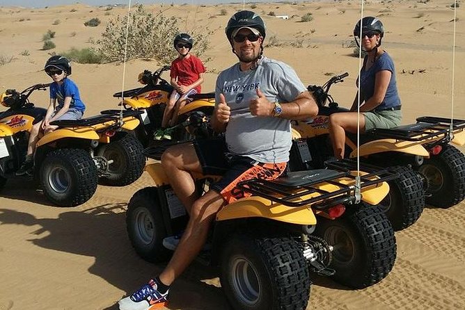 Dubai Desert Afternoon Quad Safari with Camel Ride, BBQ Dinner and Belly Dancing - Riding the dunes: adrenaline with a guide-led pace