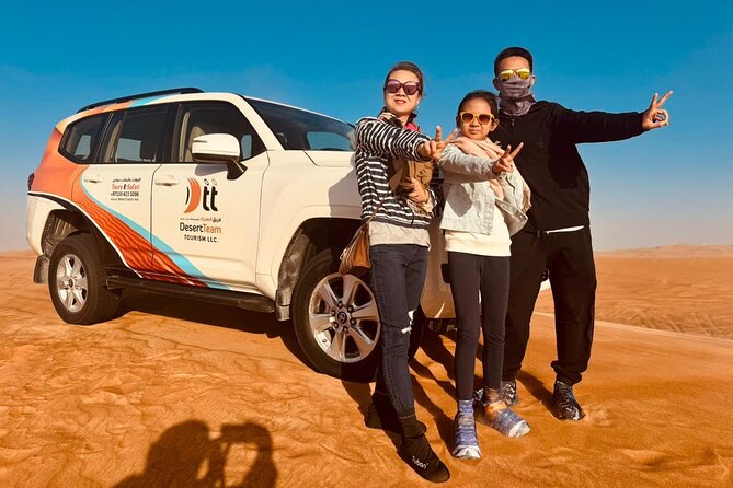 Dubai Desert Safari:BBQ Dinner, Dune Bashing & Live Entertainment - Getting Pulled Into the Dunes: Pickup, Land Cruiser Ride, and Group Size