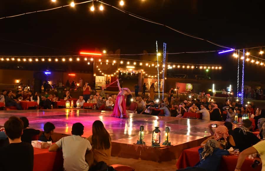 Dubai: Desert Safari, Camel Ride, and BBQ Dinner - Belly dancing and Tanura: enjoy the show, then decide about photos