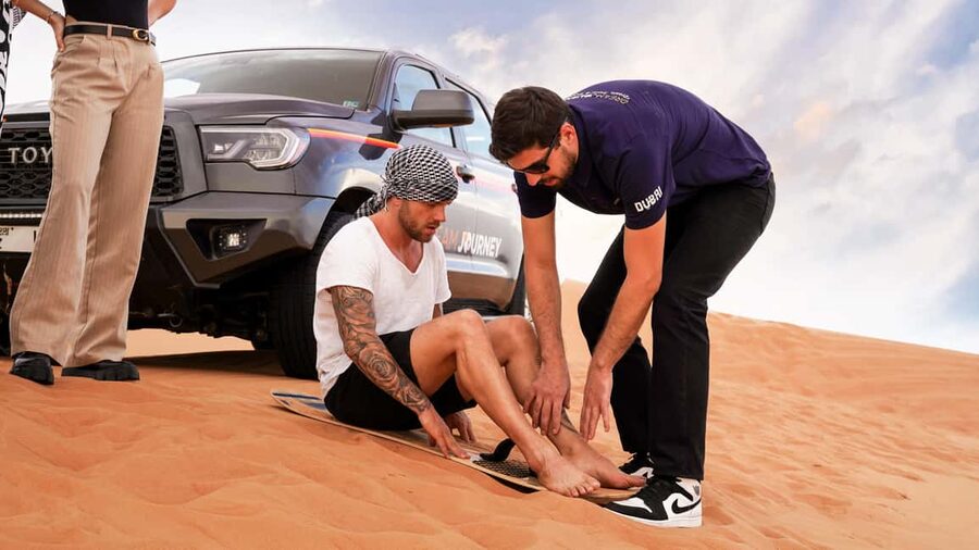 Dubai Desert Safari - Camel Ride, Sandboarding & 30 Min Quad - The Lahbab Base Stop: Tire Deflation and a Quick Reset