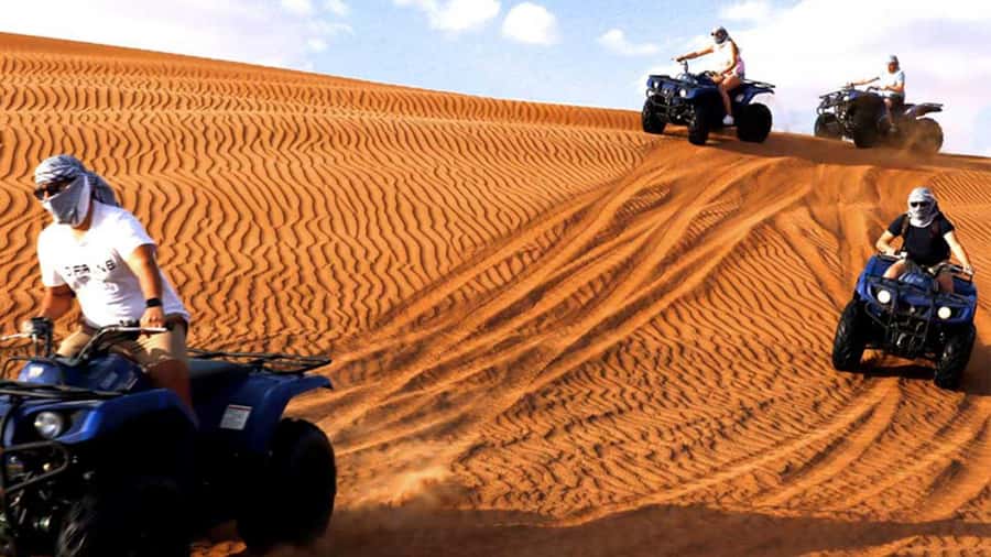 Dubai: Desert Safari, Camel Ride, Sandboarding, Quad Bike - Sandboarding on Dubai Dunes: The 15-Minute Balance Test