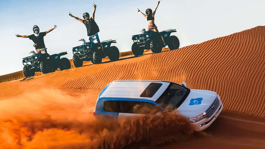 Dubai: Desert Safari, Quad Bike, Camel Ride & Al Khayma Camp - Sandboarding Over the Dunes: When the Photos Actually Come Out Good