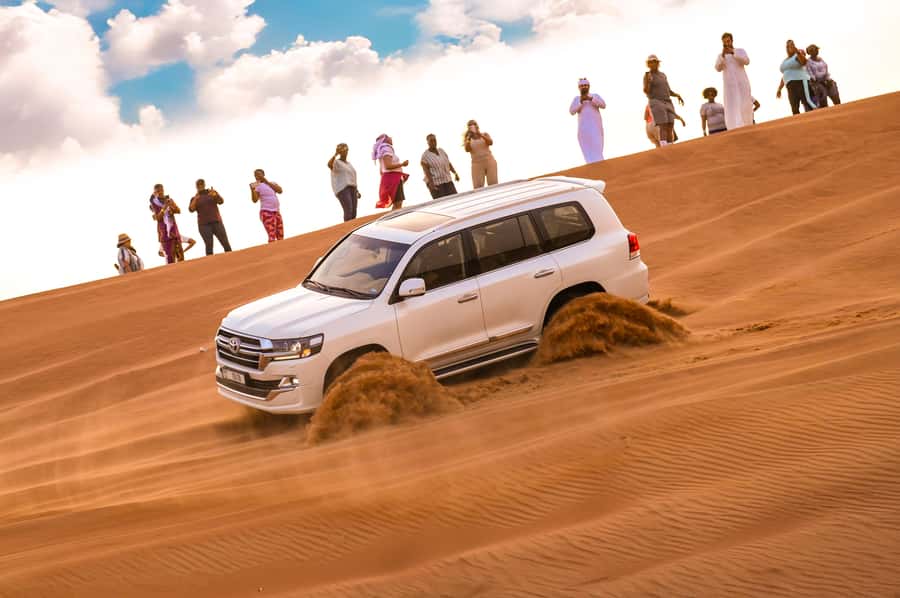Dubai: Desert Safari with BBQ Dinner & Quad Biking Options - From pickup to red dunes: what the day feels like