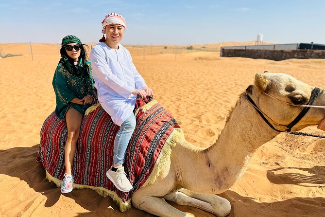 Dubai Desert Safari with BBQ Dinner & Shows from Ras Al Khaimah - The afternoon rhythm: sand boarding, sunset photos, and your camel window