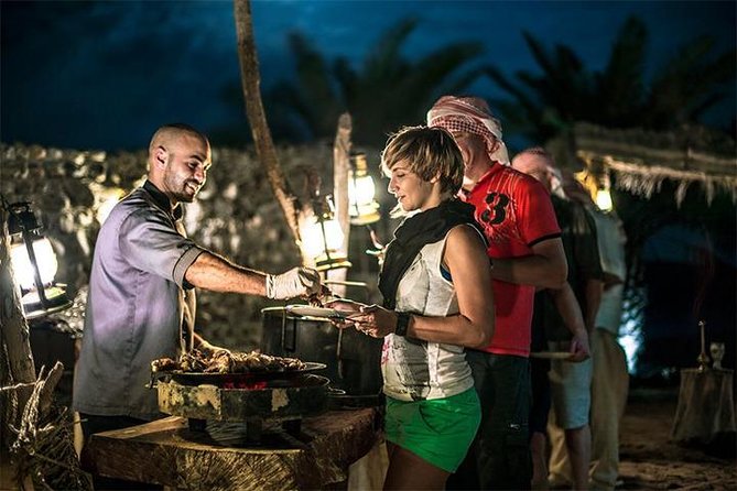 Dubai: Desert Safari with Camel Ride & Dune Bashing - Bedouin camp: henna, falconry, and bread making in a real setting