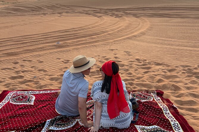 Dubai Desert Safari with Camel Ride, Sand surf, & BBQ Dinner - Bedouin Camp Welcome: Dates, Coffee, Camel Ride