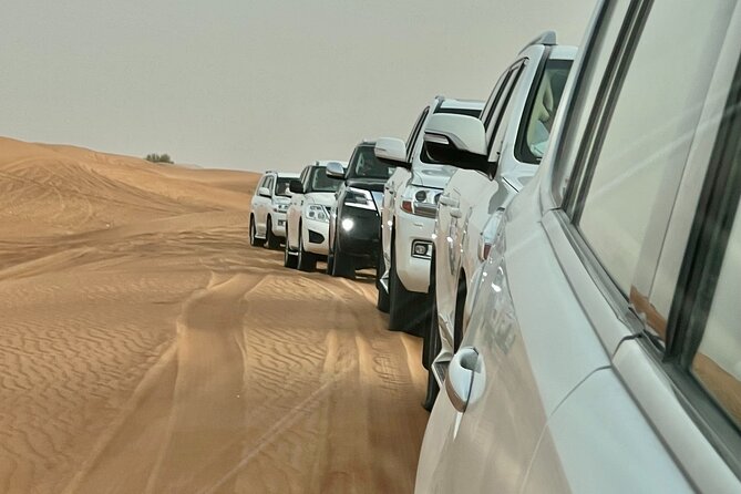 Dubai Desert Safari with Camel Ride, Sand surf, & BBQ Dinner - Live Performances While You Eat: Fun, Not a Whole Show Marathon
