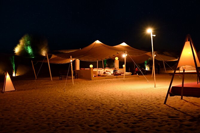 Dubai Desert Safari with Desert Camp Dinner, Camel Ride & Shows - The dinner setup: live BBQ banquet style, plus included drinks
