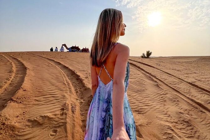 Dubai Desert Safari with Desert Camp Dinner, Camel Ride & Shows - Belly dancing, Tanoura, and a fire show under desert stars