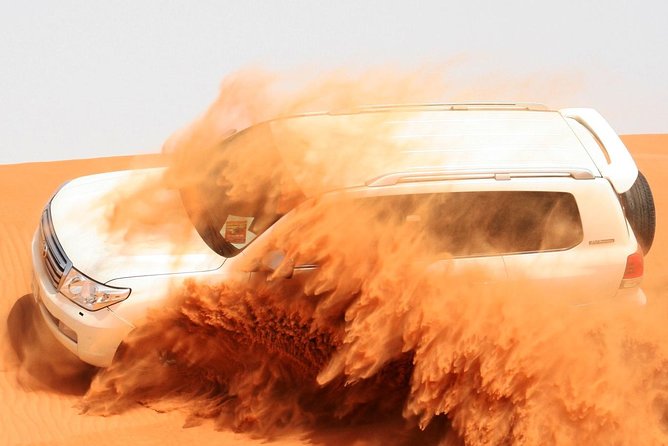 Dubai Desert Safari with Dinner in PRIVATE 4x4 Vehicle - BBQ Dinner With Belly Dance, Tanoura, and a Fire Show