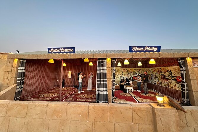 Dubai Desert Safari with dune bashing and Dinner - Desert camp setup: unlimited drinks, henna, Arabic dress, and shisha