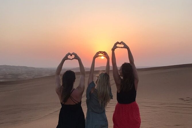 Dubai Desert Safari with Quad Biking - The dinner show sequence: buffet BBQ, belly dance, tanoura, and fire