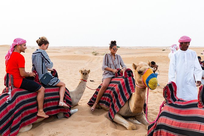 Dubai Desert Safari with Quads, BBQ Dinner, Camel ride, & Shows - Bedouin-style welcome: coffee, dates, optional shisha, and camp atmosphere