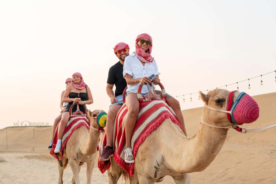 Dubai: Evening Camel Trekking & Dinner at Al Marmoom Oasis - Sunset, Falcon Photos, and Live Cooking Moments