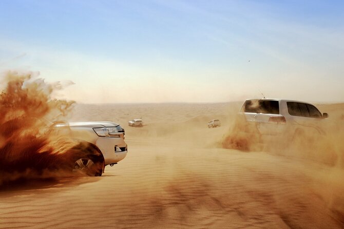 Dubai: Evening Desert Safari, Camel Ride, Shows & BBQ Dinner - Lahbab dunes: 30-minute dune bashing and guided sandboarding