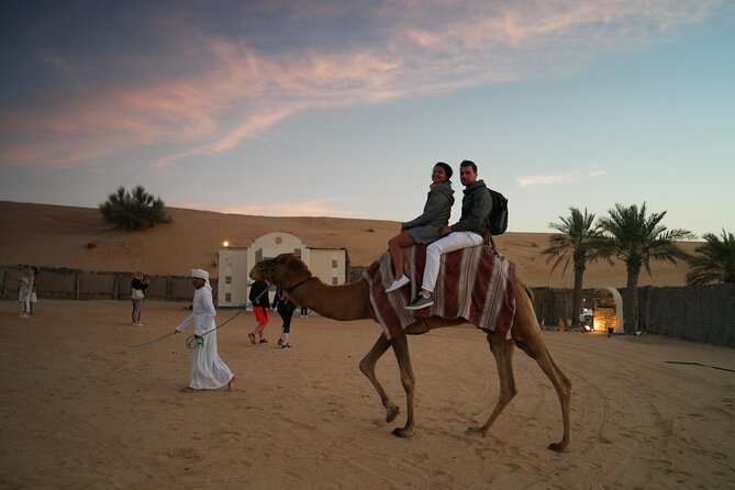 Dubai Evening Desert Safari with Thrilling Dune Buggy Adventure - The desert camp setup: majlis-style seating, tea and dates, and time to breathe