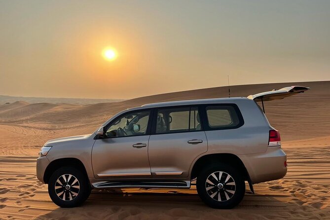 Dubai Evening Desert Safari With Transfers Dune Bashing & Dinner - The Al Awir desert camp welcome, henna, falconry, and traditional attire