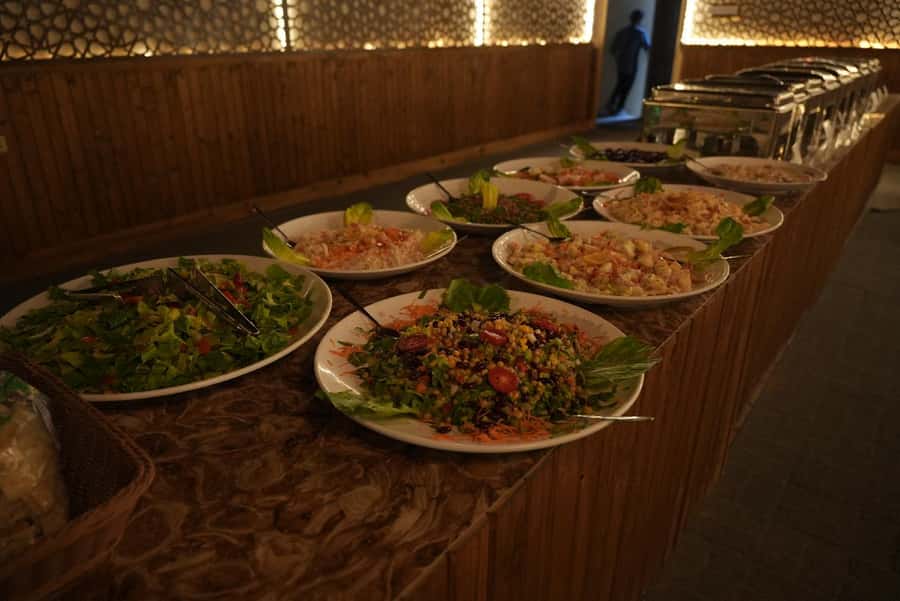 Dubai: Experience 60 Minutes Quad bike & BBQ Dinner - Al Aweer camp welcome: refreshments, photos, and quick sand prep