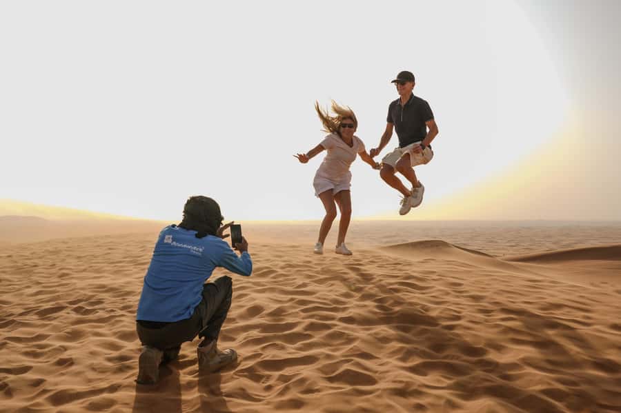 Dubai: Half-Day Desert Safari, Camel Ride, ATV & Dune Buggy - Sandboarding, how to turn one run into a whole set of photos