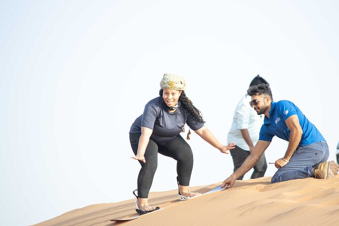 Dubai Half-day Red Dunes bashing with Sandboarding, Camel &Falcon - Sandboarding Right After, Not as an Afterthought