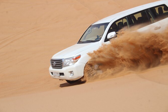 Dubai: Jeep Desert Safari, Camel Ride, and Quad Bike Tour - Sandboarding stop, plus how to make it fun (not scary)