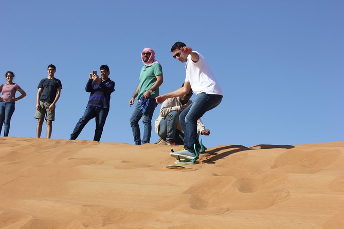 Dubai: Jeep Desert Safari, Camel Ride, and Quad Bike Tour - Camel ride at Lahbab, a calmer counterpoint