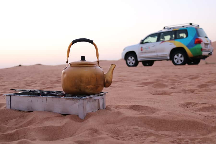 Dubai: Morning Desert Safari with Camel Ride & Sandboarding - Tire deflation and dune bashing over Lahbab dunes